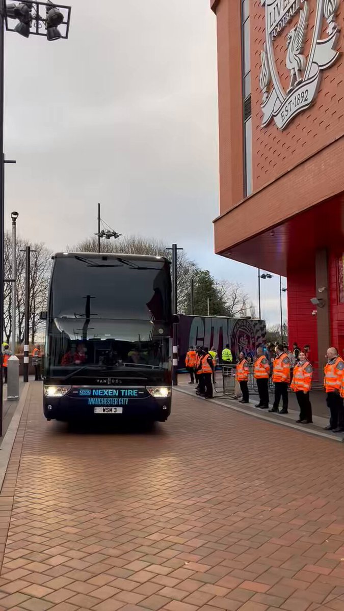 City team buses take back door into Anfield. Police didn’t let any home fans anywhere near, with hundreds gathering round the corner