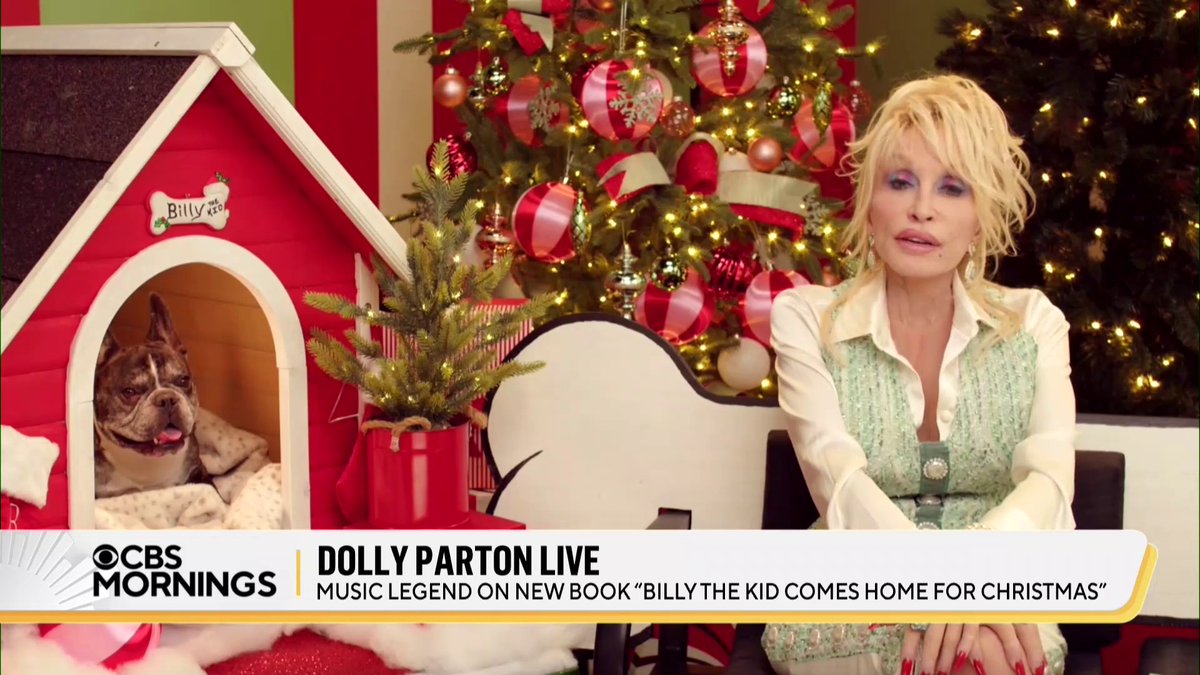 .Dolly Parton’s new children’s book, “Billy The Kid Comes Home for Christmas,” follows her real-life “God-dog” Billy. In the book, Billy seems a lot like Parton, who says that is intentional: “Billy has to be part of my Christmas since he is so much a part of me.”