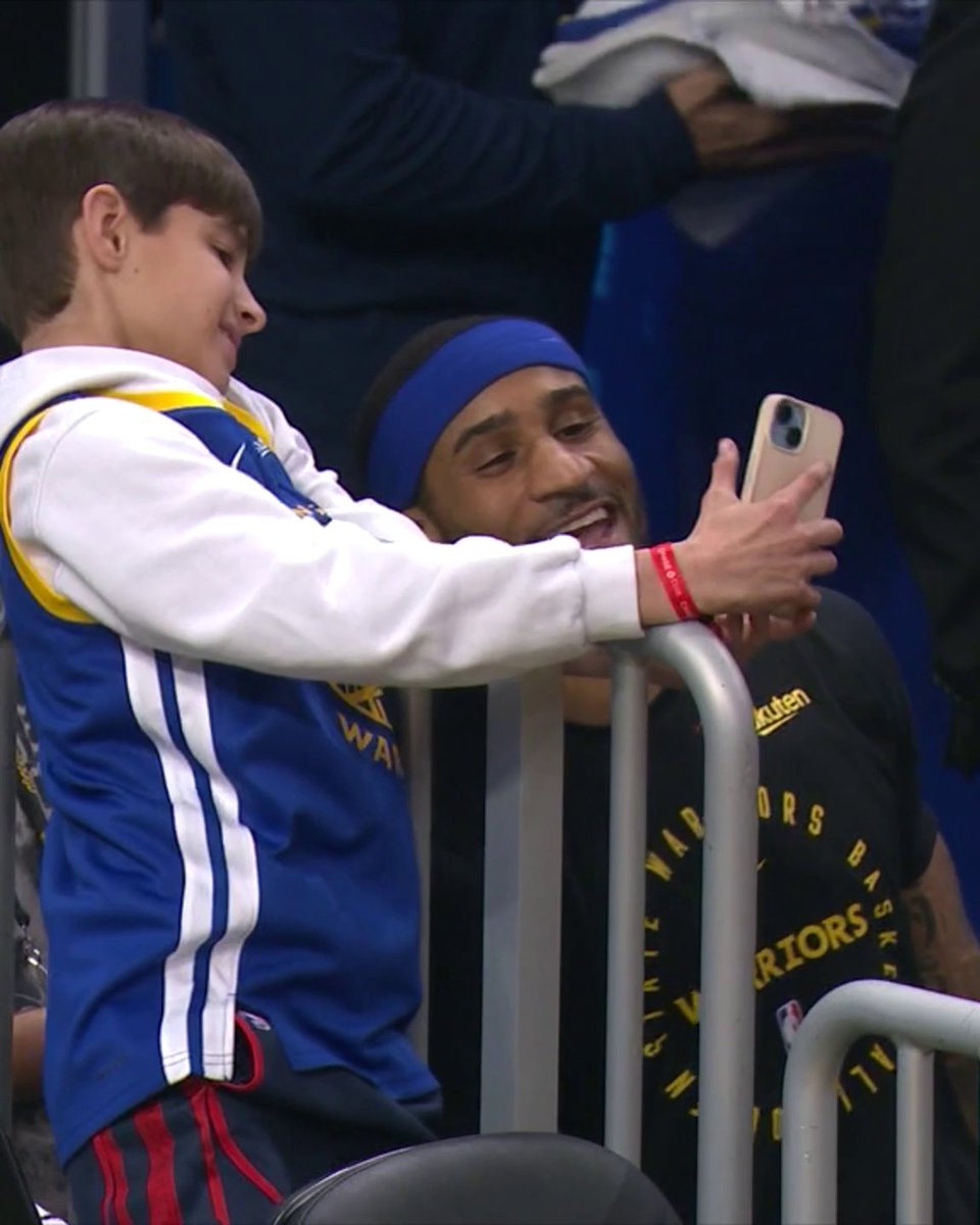 Young fan: "You gotta take [the photo]." Gary Payton II: "I CAN'T ... I'm working." 😂