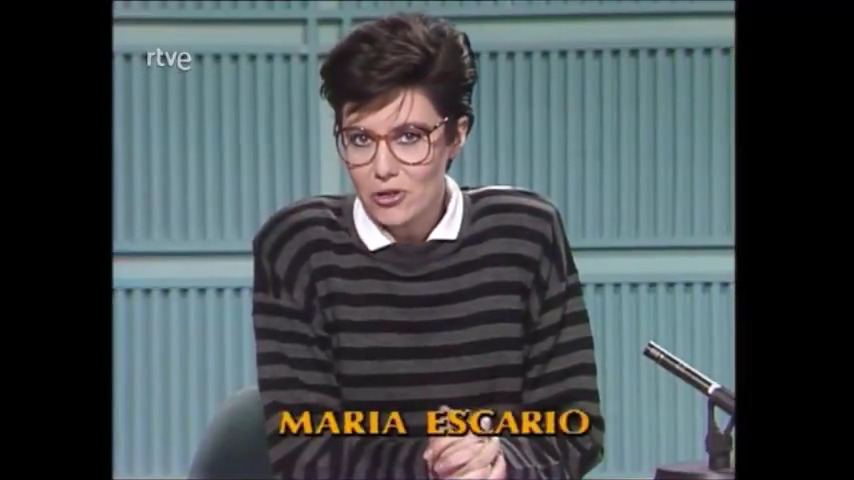 Se jubila nuestra compañera María Escario. Habitual en el salon de tu casa desde hace décadas, (casi) siempre ligada a la información deportiva, nos deja, a buen recaudo, su trabajo en ésta, su televisión. Suerte, María -- >