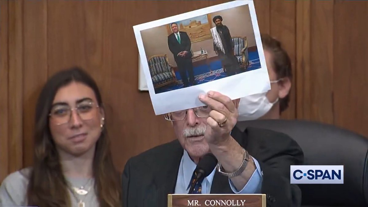 Rep. Rep. Gerry Connolly (D-VA) holds up a picture of former Secretary of State Mike Pompeo with the Taliban chief negotiator.