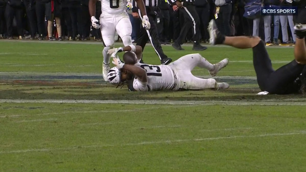 Somehow the ball never hit the ground! Navy comes up with an improbable interception.