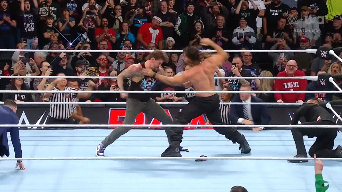 IT'S A BRAWL IN BOSTON! 👊💥 PUNK AND ROLLINS CAN'T BE HELD BACK! LET 'EM FIGHT! #WWERaw