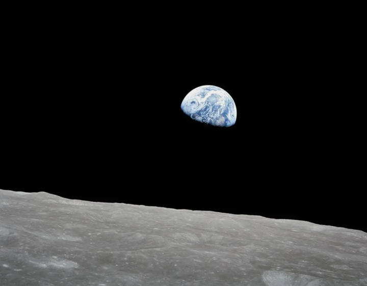 “All of you on the good Earth.” On Dec. 24, 1968, the Apollo 8 astronauts became the first humans to orbit another world. As their command module floated above the lunar surface, the astronauts beamed back images of the Moon and sent good wishes to everyone back on Earth.