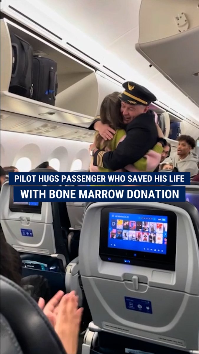 'A TRUE HERO': A United Airlines pilot took a moment to step out of the cockpit and give a hug to the flight passenger who saved his life eight years ago with a bone marrow donation.