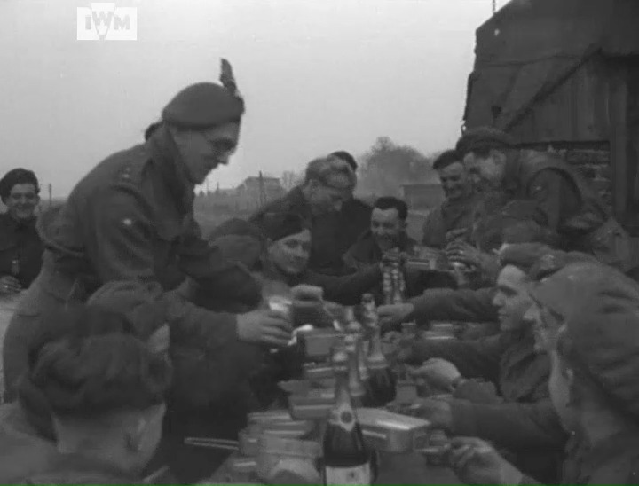 British soldiers celebrate Christmas with Dutch civilians just behind 53rd (Welsh) Division's frontline in the Netherlands, 25 December 1944. Film: IWM A70 217-3