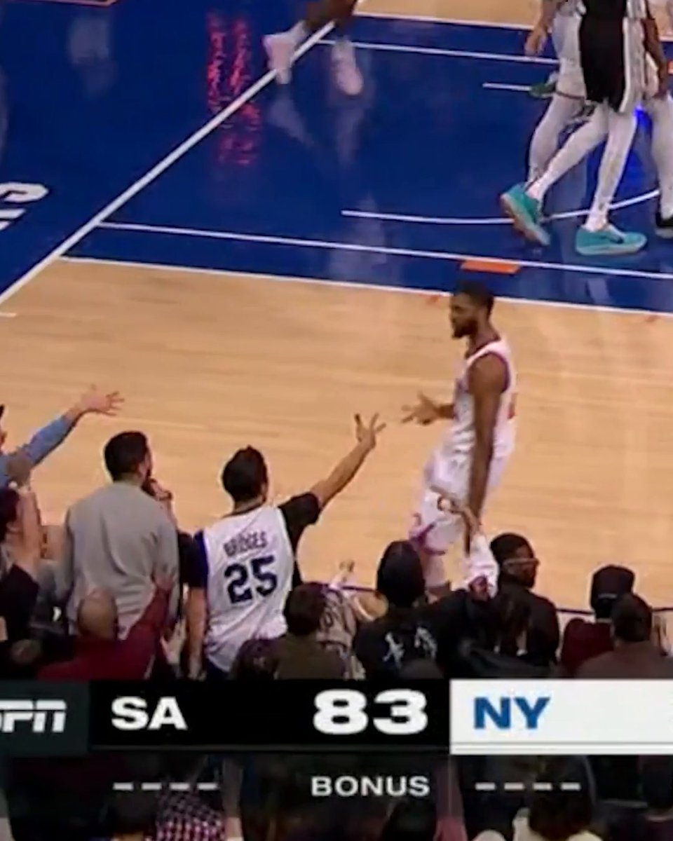 Mikal Bridges celebrated with this fan after the three 🔥😂