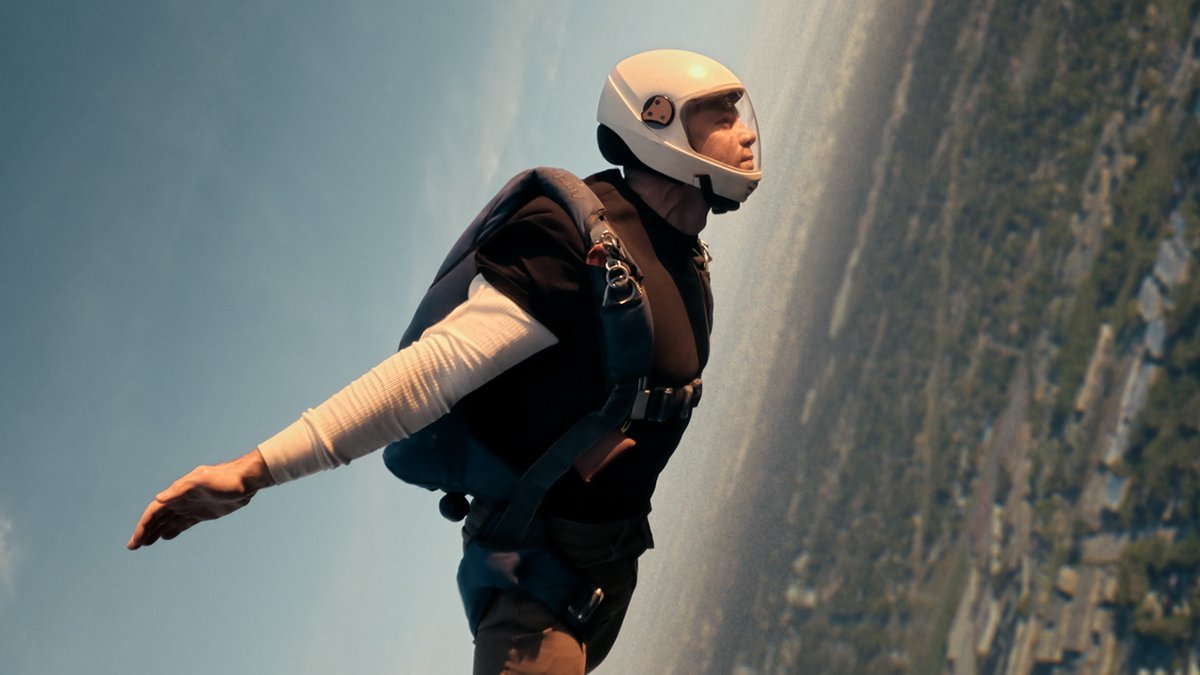 Gabriel Basso jumping out of a blimp to premiere ‘THE NIGHT AGENT’ Season 2 trailer at the NFL.