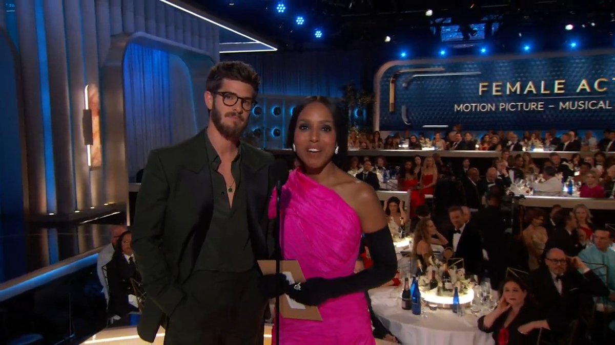 And now... Andrew Garfield and @kerrywashington take the stage to celebrate the magic 🪄 of film and present the #GoldenGlobes award for Best Female Actor – Motion Picture – Musical/Comedy!