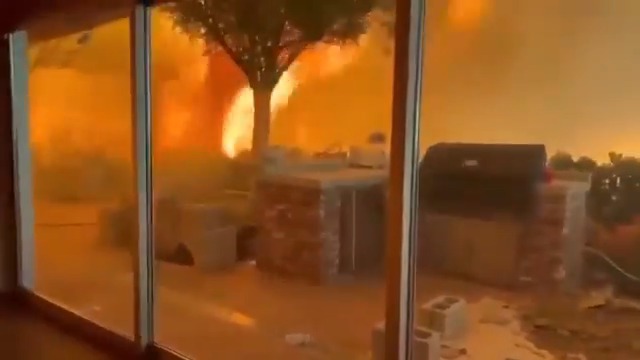 Terrifying footage of the raging fires in Los Angeles shows people stuck inside a home with their dog surrounded by the inferno. Full, horrifying story: