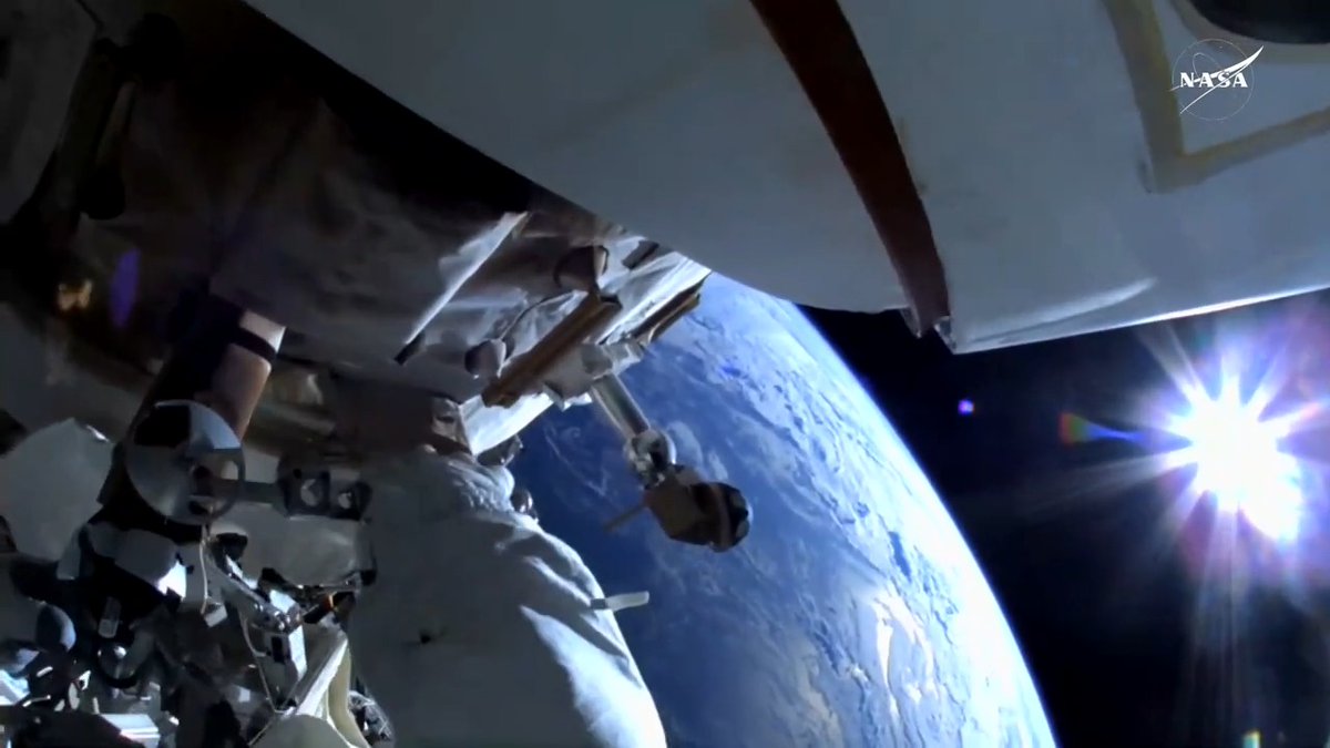 This view from Sunita Williams's helmet camera shows her turning bolts as she replaces the planar reflector, a visiting vehicles navigation device, over 260 miles above the South Pacific Ocean.