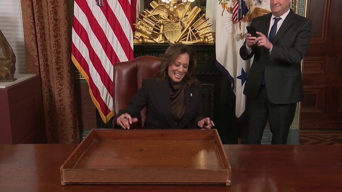 MOMENTS AGO: Vice President Kamala Harris marks her final days in the Biden administration by adding her signature to her ceremonial office desk.