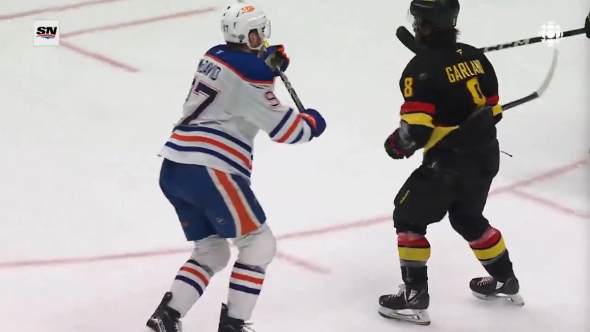 Connor McDavid snaps with a BRUTAL cross-check on Conor Garland at the end of the game 😳 McDavid received a match penalty and was ejected.