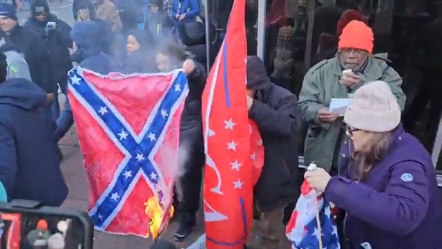 Members of the Revolutionary Communists group tried to burn an American flag in D.C. to protest the inauguration of Donald Trump, who they call a fascist. A Trump supporter grabbed the flag before it could be set