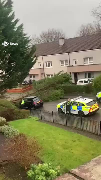 Police officers in Glasgow narrowly avoided being hit by a falling tree as Storm Eowyn wreaked havoc across Scotland.