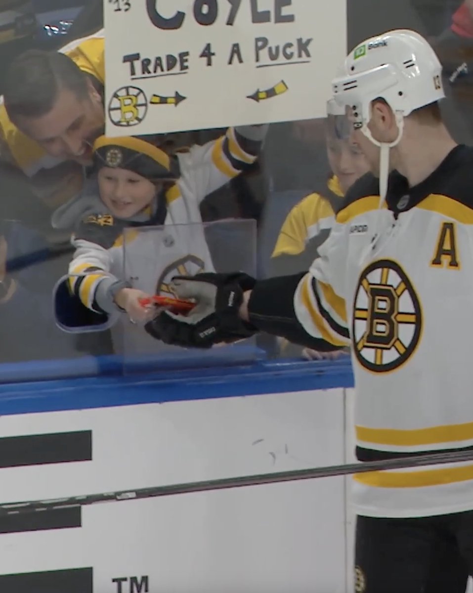 Charlie Coyle receives candy in exchange for a puck. Seems like a fair trade all-around 🤝