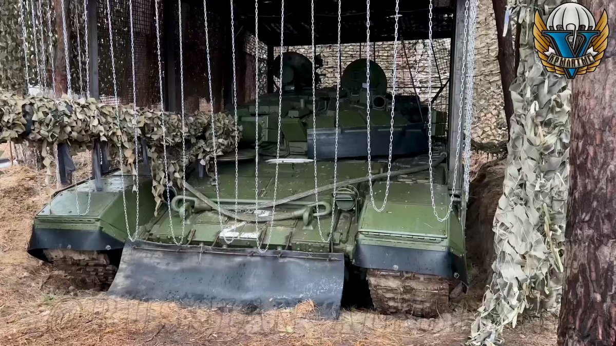 A Russian T-72B3M with a more traditional fixed cage armor, that only allows limited movement of the turret but with the fatal weakness of the turret-hull join covered.