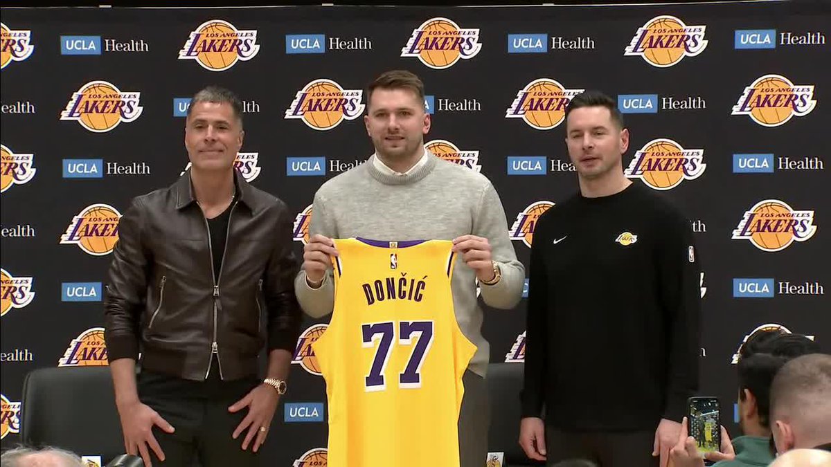 First look at Luka Doncic holding up his No. 77 Lakers jersey 🔥