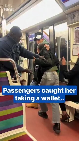 Furious passengers catch pickpocket on subway train.