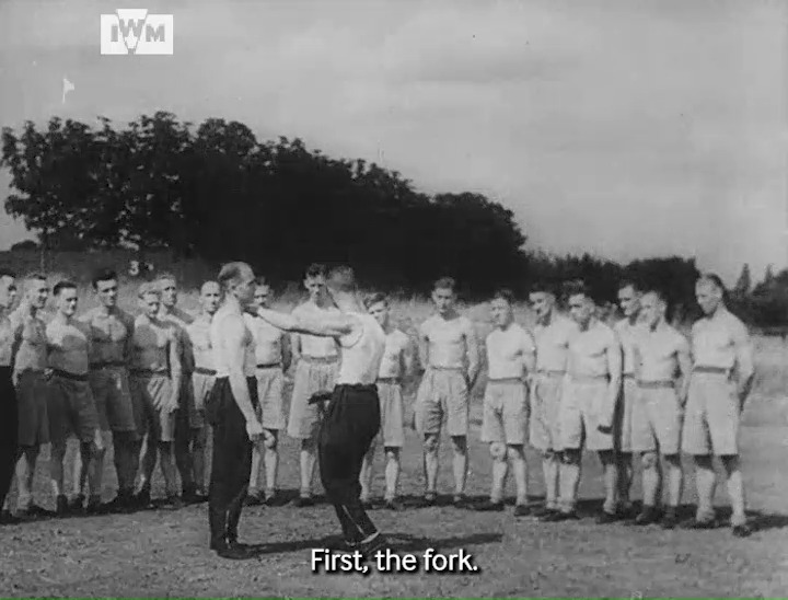 Men learn methods of attack and defence in unarmed combat during the Second World War. Film: IWM DRA 202 <1/2>