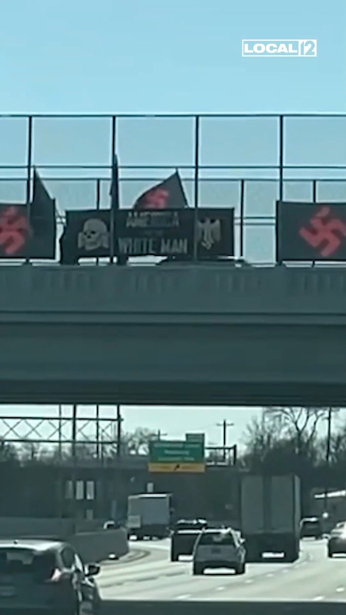 A small group with Nazi flags stopped traffic Friday afternoon on an overpass connecting Lincoln Heights and Evendale. The group had their faces covered. A sign read "America for the White Man." More: