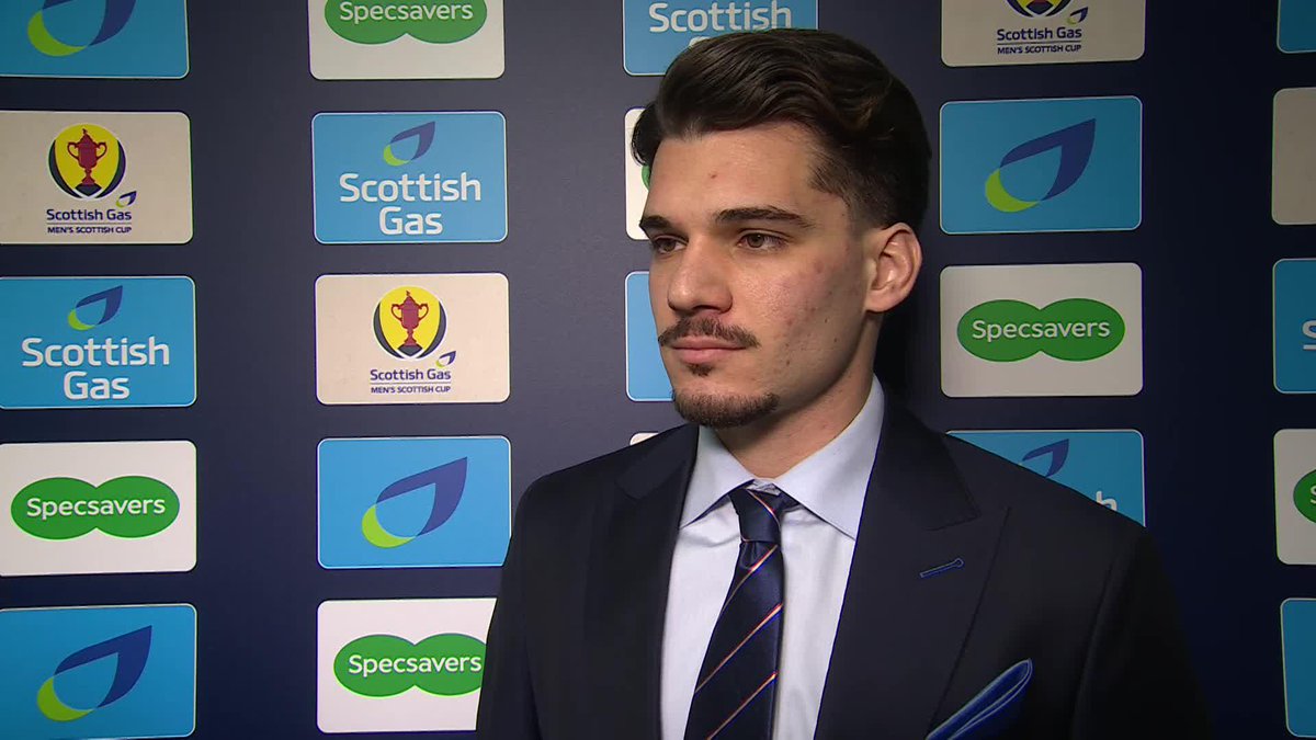 A suited up Ianis Hagi in discussion before Rangers Football Club's tie against Queen's Park 🔵 "There's an opportunity to win a trophy, so when these occasions arise, we have to go there and grab it." 🗣️ #ScottishCup