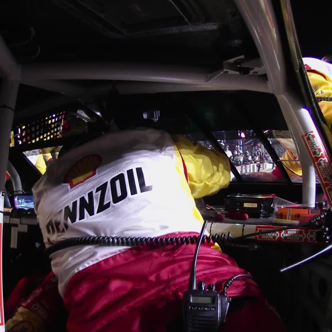 The No. 22 team addresses electrical issues for Joey Logano on pit road.