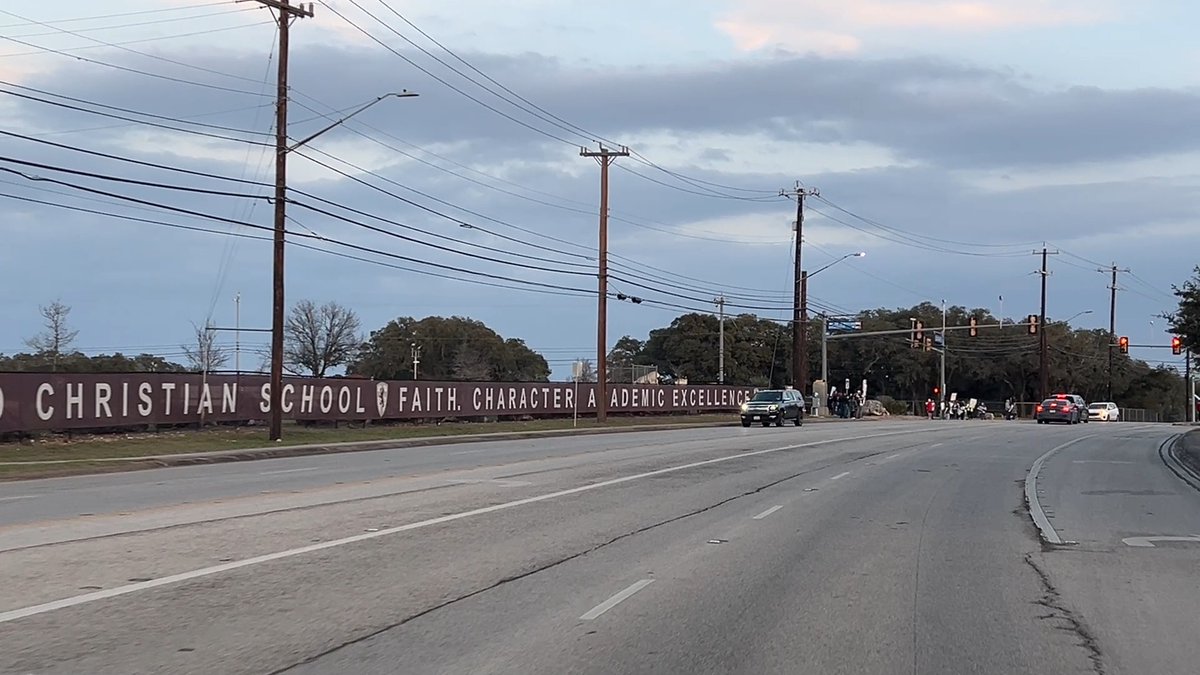 We're live as protestors gather outside San Antonio Christian School as Governor Greg Abbott speaks at an event in support of school choice vouchers, an initiative critics call "anti-public education." (📽️ Joy Burgin)