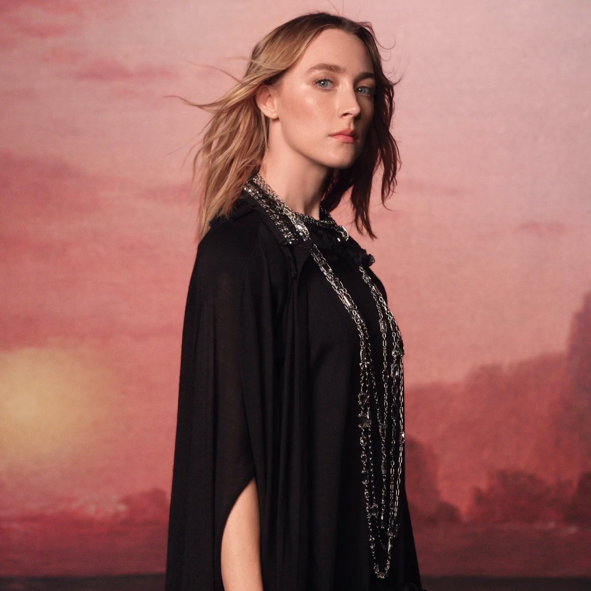 #NicolasGhesquiere's #LVSS25 Collection reveals a wardrobe of feminine fluidity, embodied by House Ambassador #SaoirseRonan who appears as a portrait within paintings by artist #LaurentGrasso. Discover at #LouisVuitton