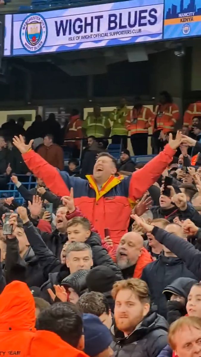 SINGING IN THE RAIN. 🌧️ Liverpool fans serenade their team after the final whistle.