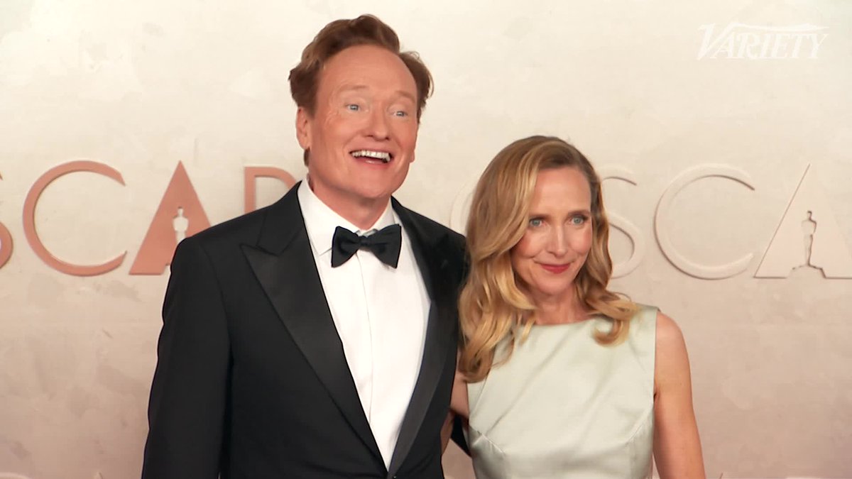 Conan O'Brien and Liza Powel O'Brien on the carpet at the #Oscars