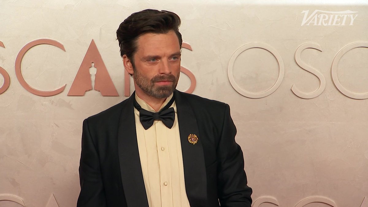 Sebastian Stan poses for photos at the #Oscars
