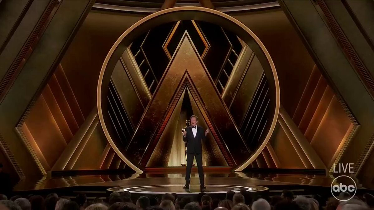 ADAM SANDLER SHOWS UP TO OSCARS IN BASKETBALL SHORTS AND HOODIE While Hollywood's elite arrived in designer gowns and tailored tuxedos, Sandler stayed true to his signature casual style at the Academy Awards—basketball shorts and a hoodie. When host Conan O'Brien joked he looked "like a guy playing video poker at 2 a.m.," Sandler responded perfectly: "Nobody even thought about what I was wearing until you brought it up!" Source: NBC