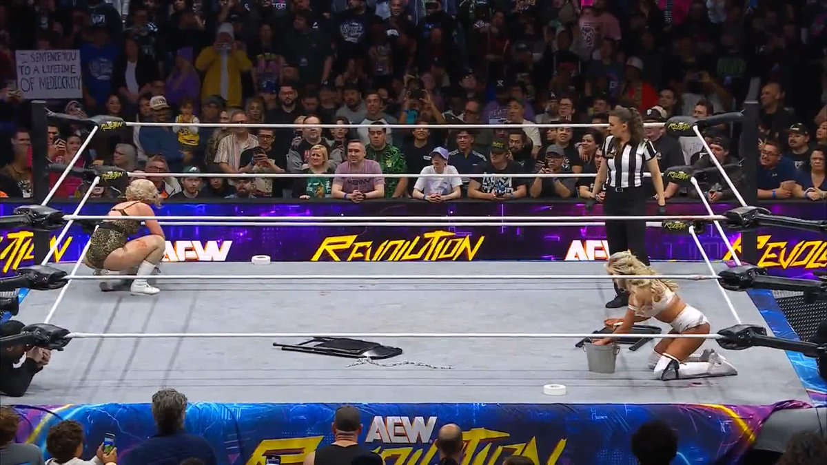 Broken glass on each others’ taped wrists! #AEWRevolution