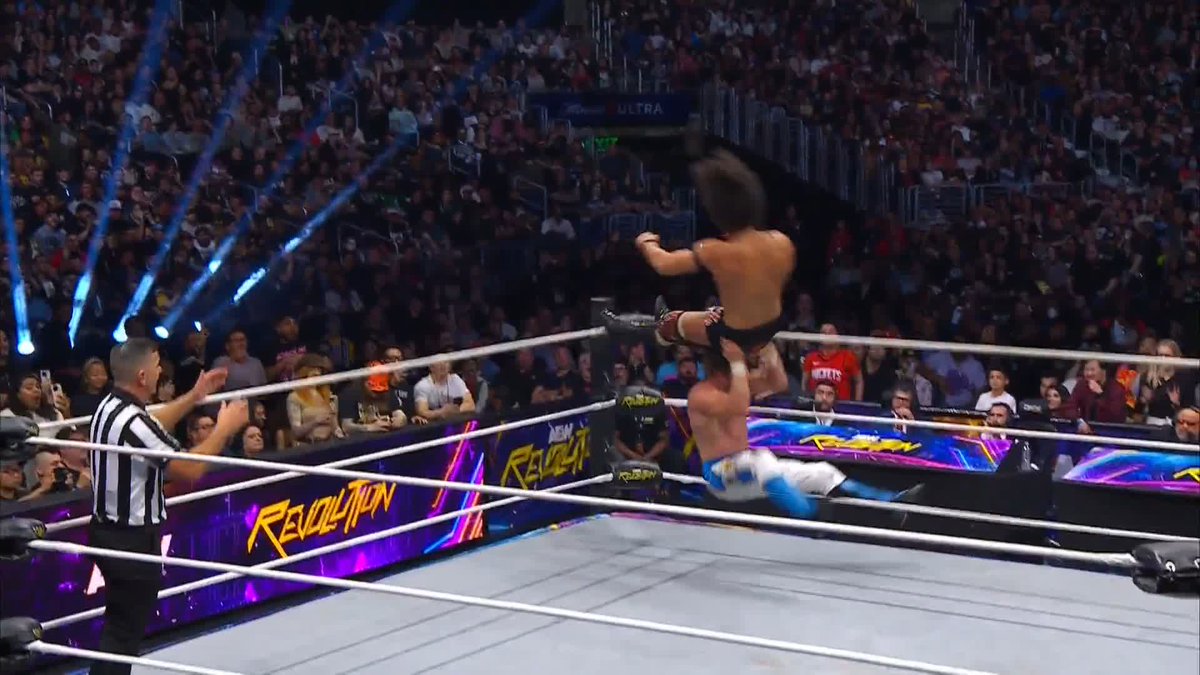 Kenny Omega sends Konosuke Takeshita FLYING! Watch #AEWRevolution on PPV right now! Konosuke Takeshita | Kenny Omega