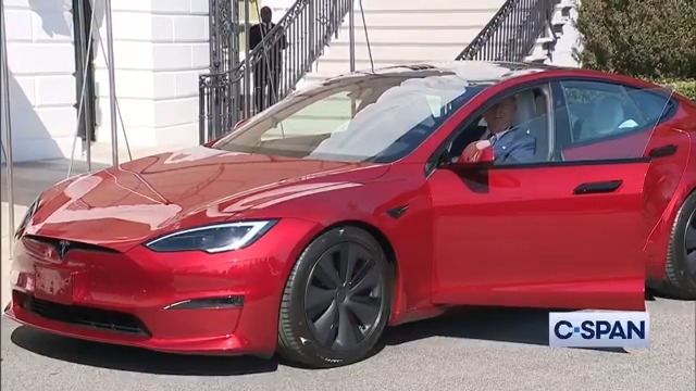 President Trump gets into a red Model S with Elon Musk at the White House.