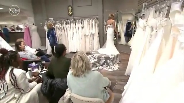 Tariffs are adding pressure to brides like Jessica Stone, who rushed to buy her wedding dress before potential price hikes. More than 80% of gowns are made in China, and past tariffs have already driven up costs.
