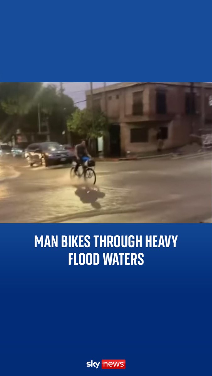 A cyclist braved the torrential rain in Argentina and biked through heavy floods