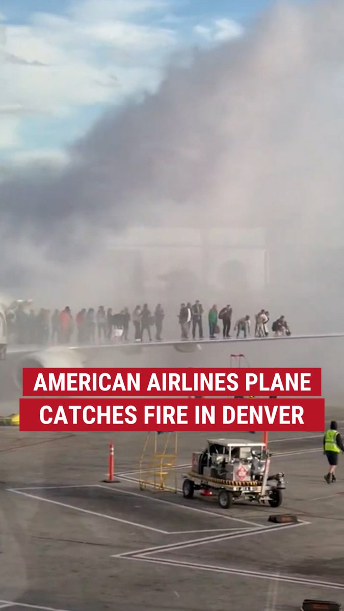JUST IN: Frightening footage captures an American Airlines plane on fire at Denver International Airport as passengers were forced out onto the wing.