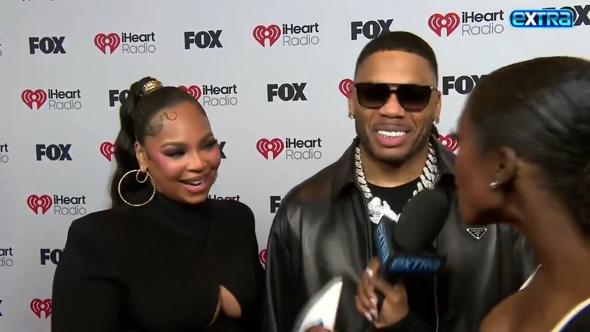 Nelly jokes about Ashanti's monthly photoshoots with baby boy Kareem! 📸🥰 Plus, will we get another Nelly and Ashanti musical collab? 🎶 #iHeartAwards2025