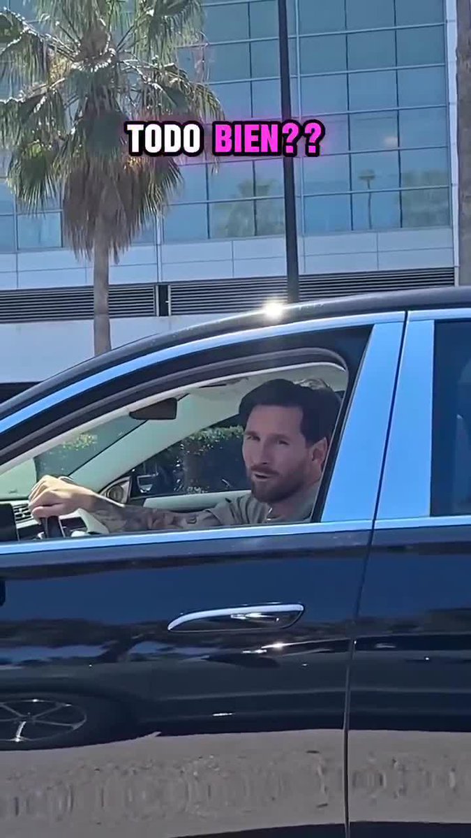Lionel Messi interacting with a fan from one car to another!