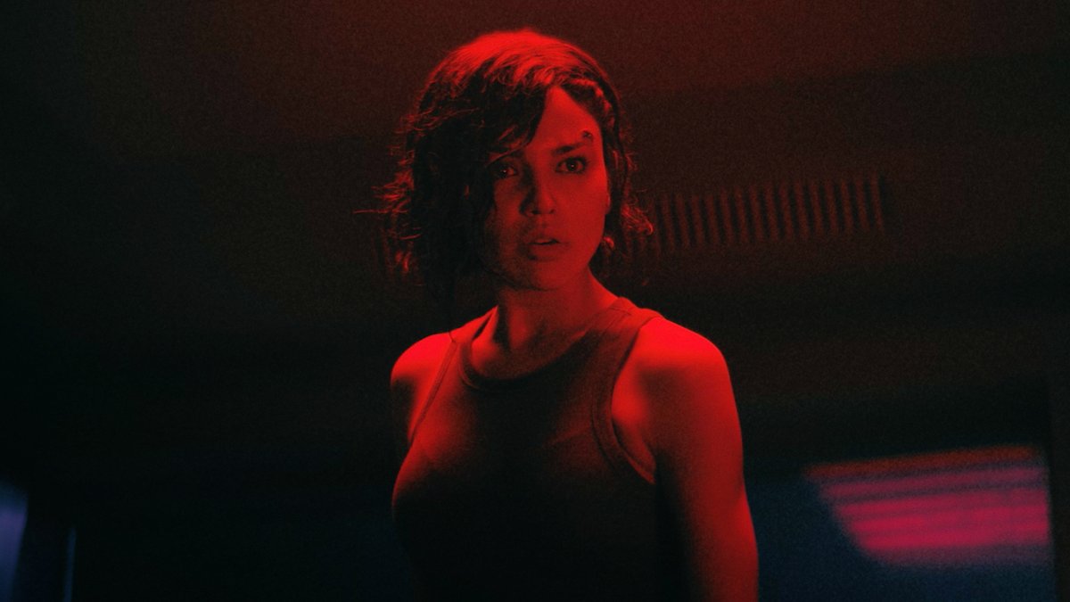 Eiza González and Aaron Paul face off against each other in this exclusive clip from #Ash. Flying Lotus' new sci-fi film is in theaters tomorrow.