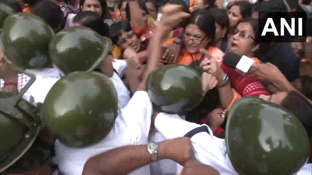 #WATCH | West Bengal: Scuffle breaks out between police and BJP leader Roopa Ganguly protesting in Kolkata against Trinamool Congress (TMC) government over the introduction of a bill permitting women to work in bars.