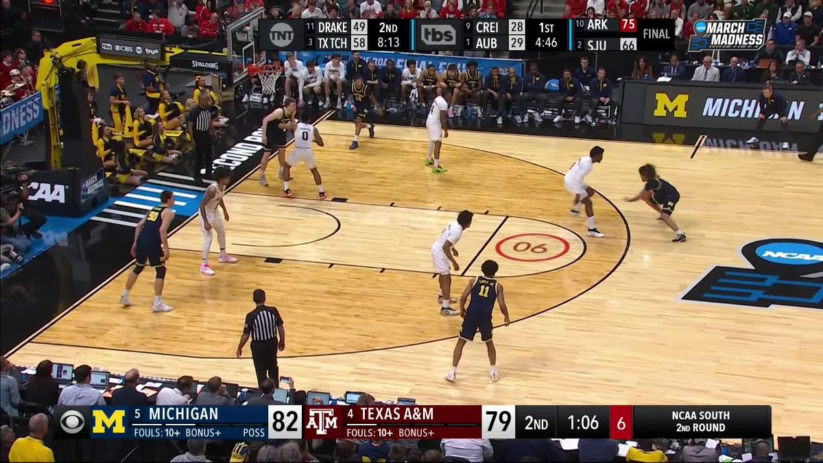 A CIRCUS SHOT FROM TRE DONALDSON TO PUT MICHIGAN UP TWO POSSESSIONS
