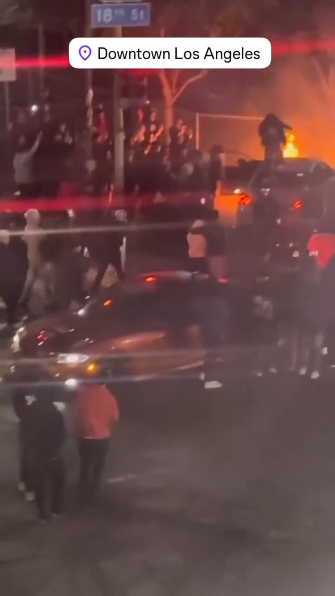 Driver (presumably stole the car) does some donuts during a Los Angeles #StreetTakeover then drives it on to a fire 🔥 Imagine risking committing grand theft auto only to do some donuts and leave the car to burn - morons. #CityLife #california #LosAngeles #crime #decay #gotham #FAFO #darwin #IQtest #urban #democrats