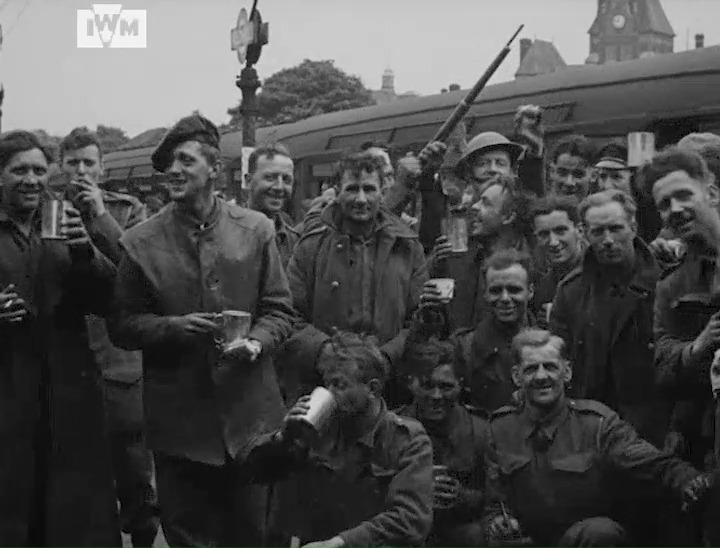Troops of the British Expeditionary Force celebrate at Redhill train station following their evacuation from Dunkirk, 1 June 1940. Film: IWM BTF 8