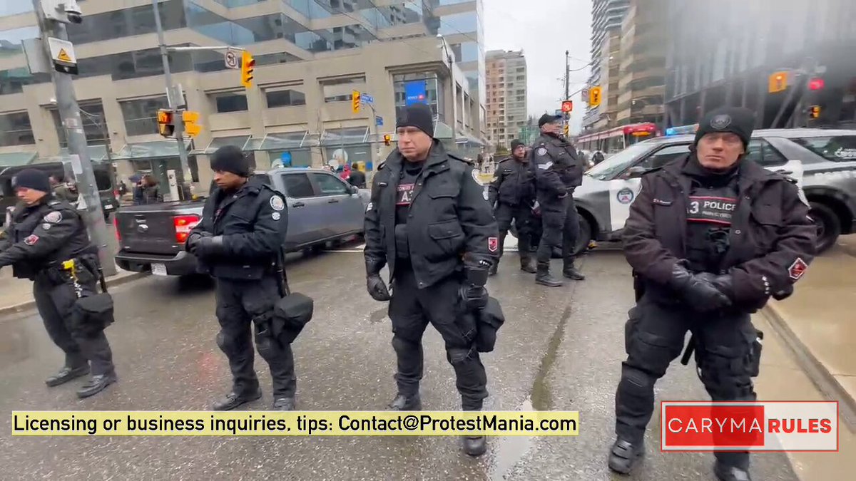 Police manage direction of the march by blocking select roads, a tactic driven by protesters’ refusal to disclose their planned route in advance. #cdnpoli #Toronto #Palestine #Israel #Gaza #LandDay #ProtestMania