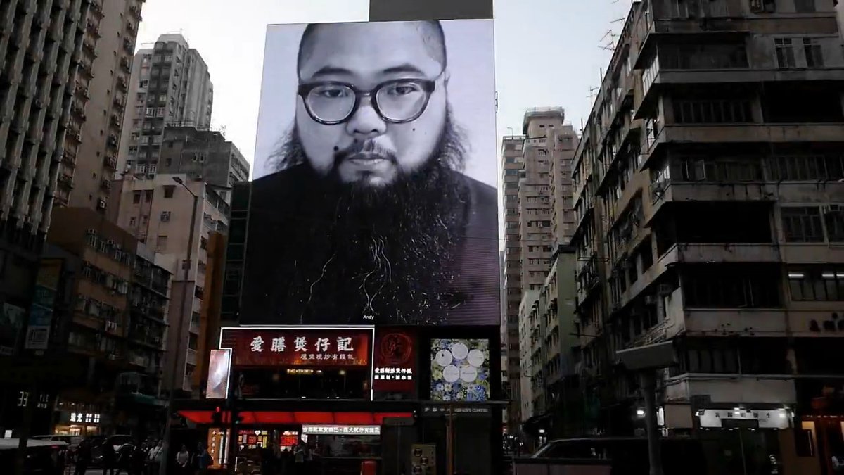 "HERE AND NOW" —— A video work by Badiucao for Hong Kong 2025 Vertical Billboard | 33A, Argyle Street, Mong Kok Horizontal Billboard | 6-12 Sai Yeung Choi Street South, Mong Kok March 28 to April 3 | From 10 am to 10pm every hour - every days