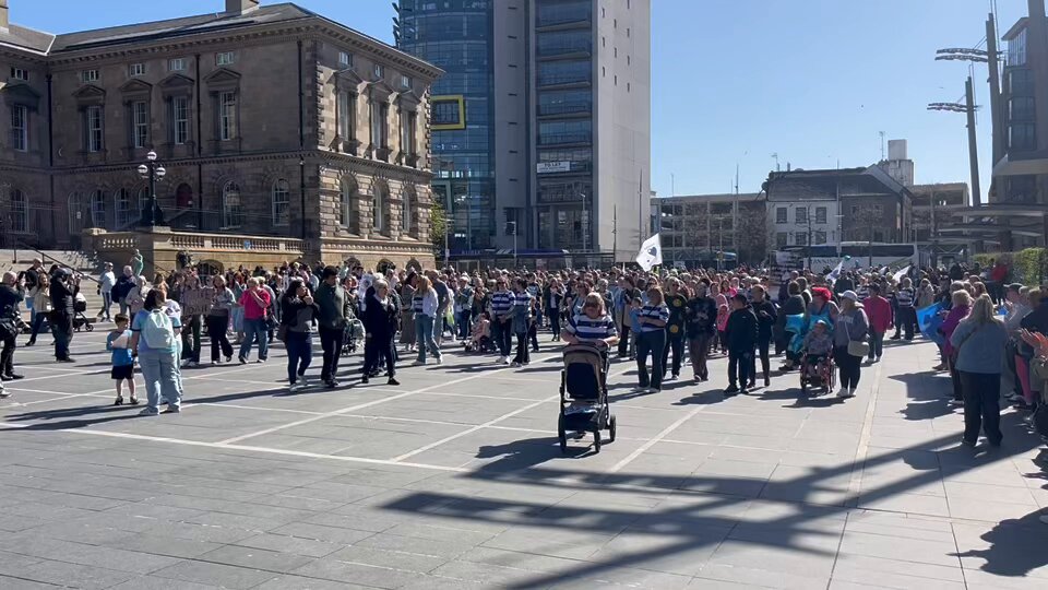Crowds are about to set off from Custom House Square for the Noah Donohoe rally - plenty of noise being made, with drums, clapping, cheering and whistles Belfast Live