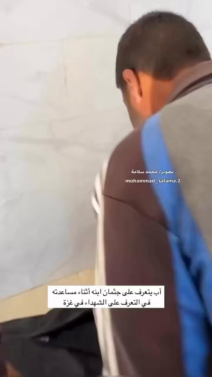 A father identifies the body of his son whilst helping others to identify the bodies of their relatives in the hospital.